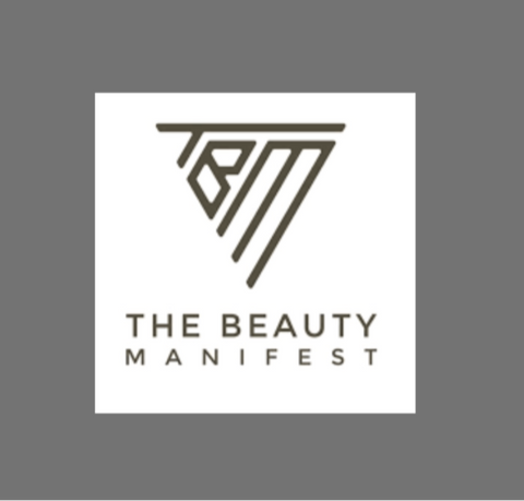 Logo of The Beauty Manifest on a gray background