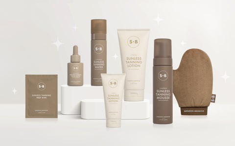 Collection of S+B tanning products including bottles, lotion, mitt, and box on a white background