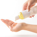 Hocoba Oil being poured into a cupped hand 