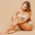 Woman touching her bare legs