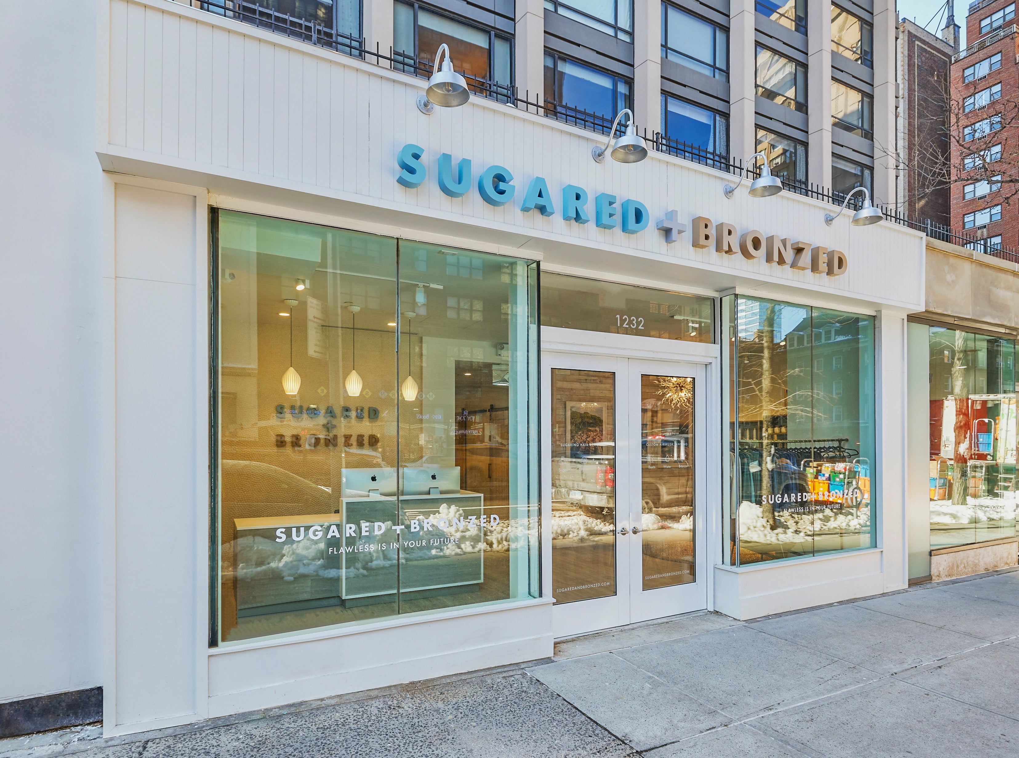 Entrance to Sugared and Bronzed store in a metropolitan city.