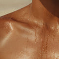 Sweat dripping down a neck and chest
