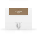 A white box with a dispenser faucet for Elixir Four tanning solution